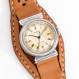 vintage movado watch dial shot, on its back