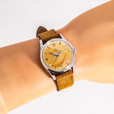 vintage omega wristwatch stainless steel wrist shot, close up