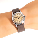 the doxa watch as seen on a wrist, close up