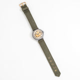 vintage waltham wwii watch lying on its back shot