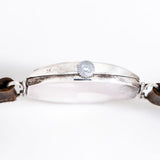 vintage omega tonneau crown shot, on its side