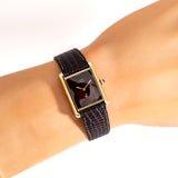 cartier tank brown dial shot, wrist shot close up