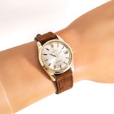 vintage omega yellow gold capped seamaster wrist shot, close up