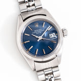 rolex blue dial laying on its back