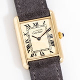 cartier tank laying on its back