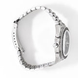 omega speedy lying on its side, crown pointing up