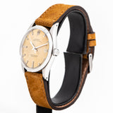 rolex oyster perpetual aged dial crown shot
