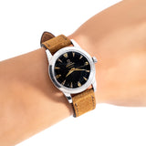 vintage omega seamaster black wrist shot, close up