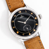 vintage omega black dial dial shot, on its back