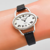 vintage vulcain oval shaped timepiece, wrist shot close up