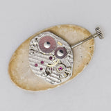 vintage vulcain oval shaped timepiece,  movement 