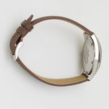 image of the omega seamaster on its side with the case back showing